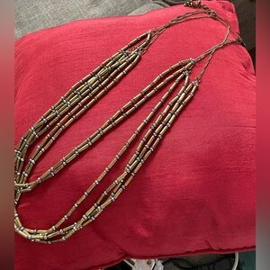 Chico’s layered bronze bead and faux diamond necklace
NEW